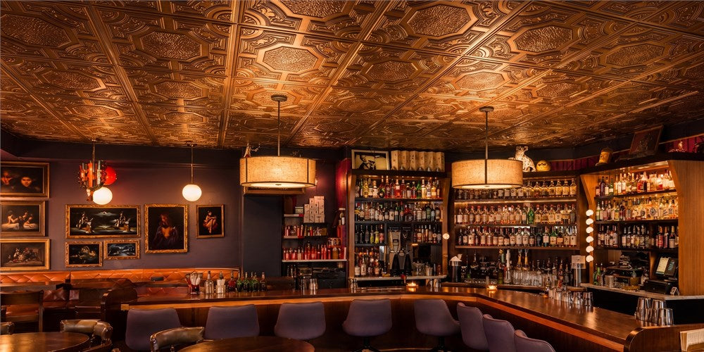 How PL02 Aged Copper Ceiling Tiles Turn a Cocktail Lounge into a Gilded Retreat