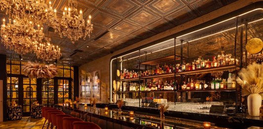 PL06 Weathered Copper ceiling tiles installed above an elegant cocktail bar